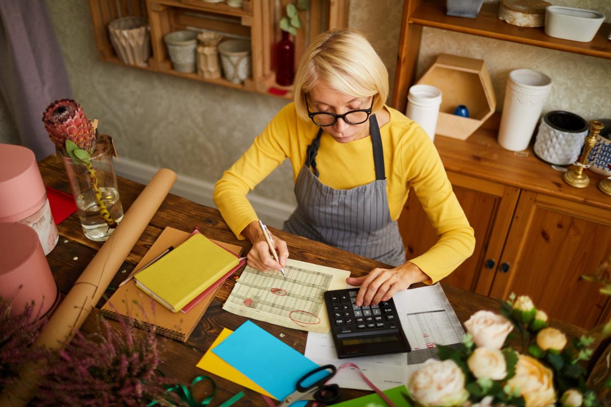 Woman prepares legal documents to protect her small business from possible lawsuit