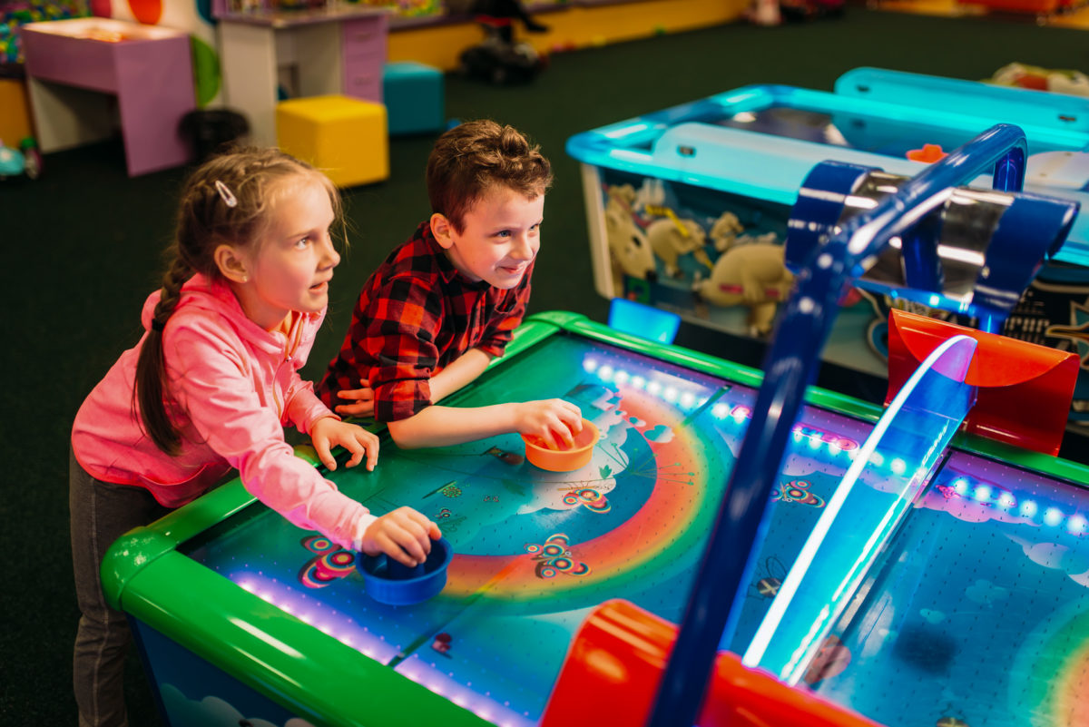 Two children play at Chuck-E Cheese, an American family entertainment center