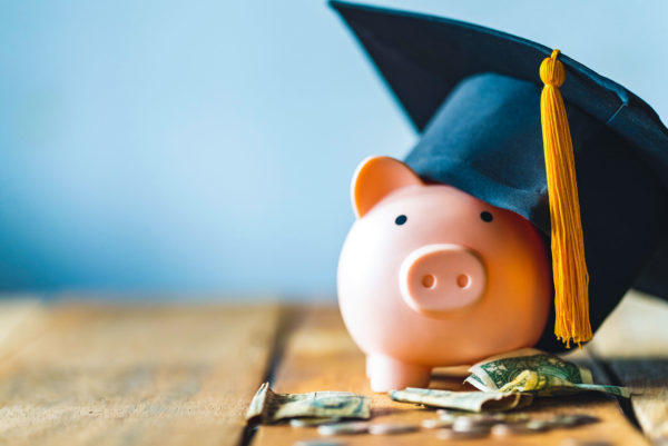 Piggybank in graduation cap representing college savings fund