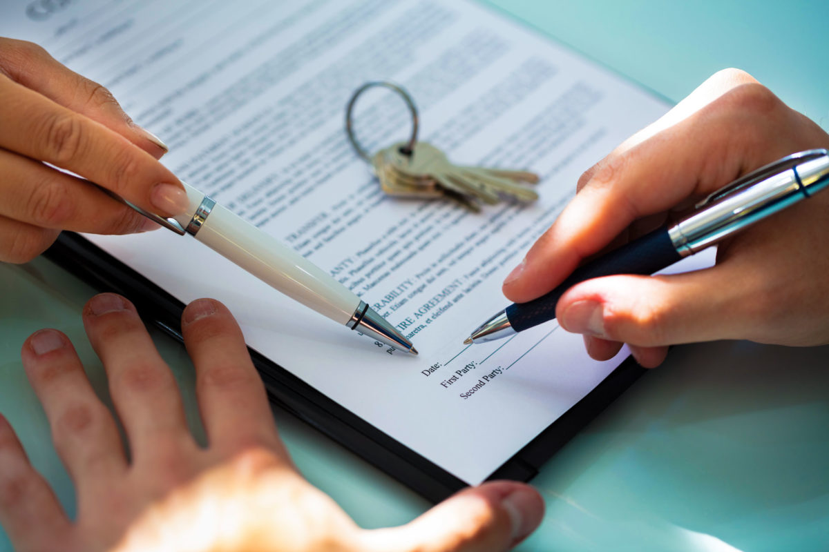 Person signing a residential lease agreement