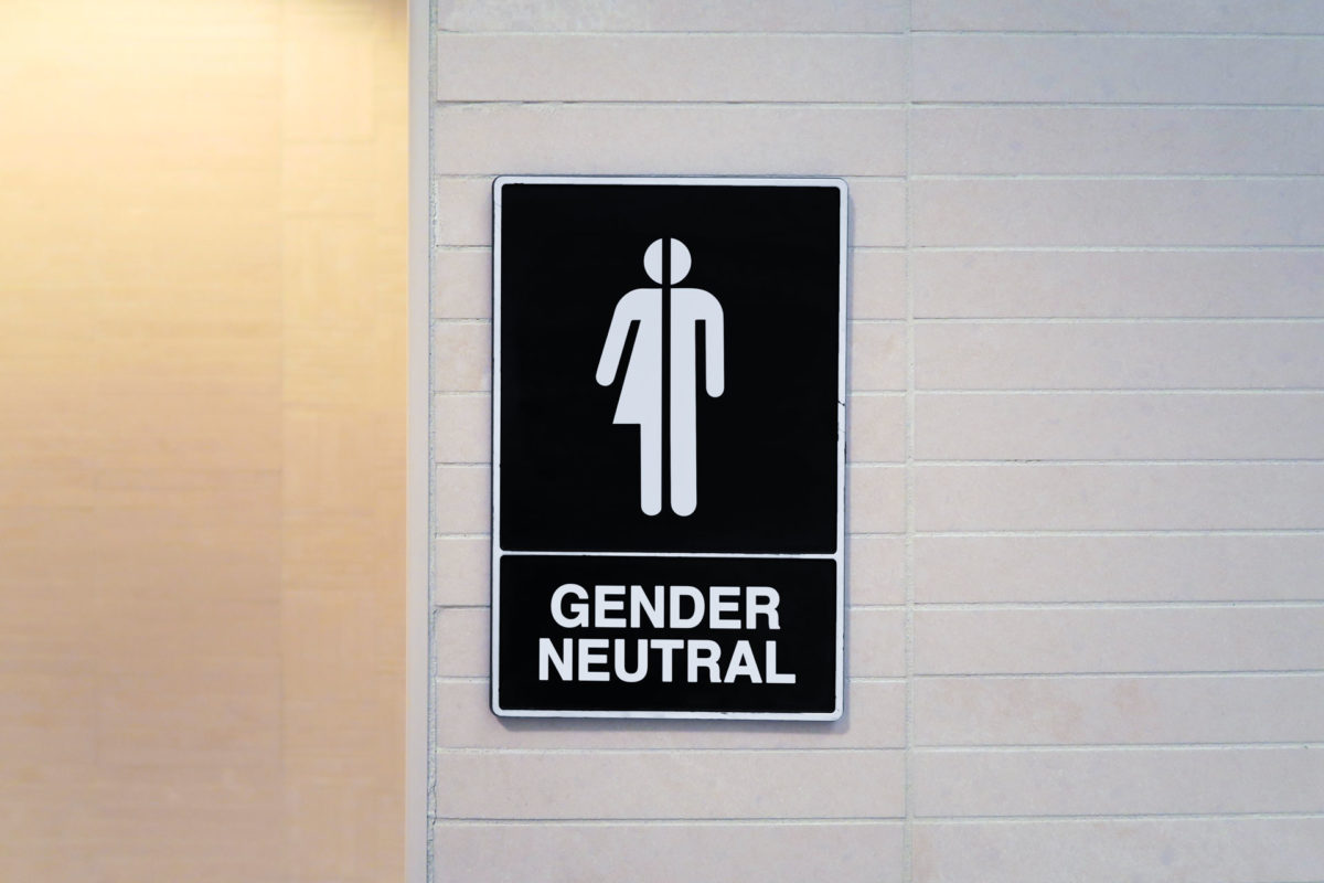 wall sign indicating gender neutral or transgender restroom