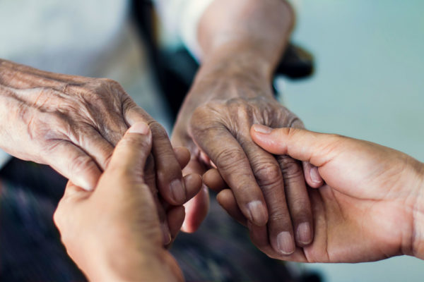 person cares for elderly parent