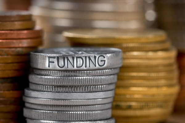 coins stacked on top of each other to fund a trust