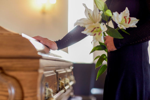 woman faces death at a funeral