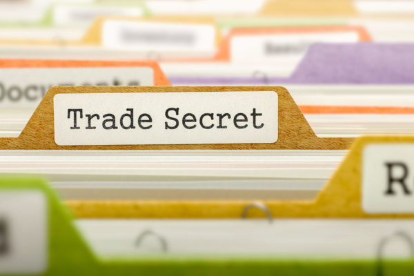 manila file folder labeled trade secrets