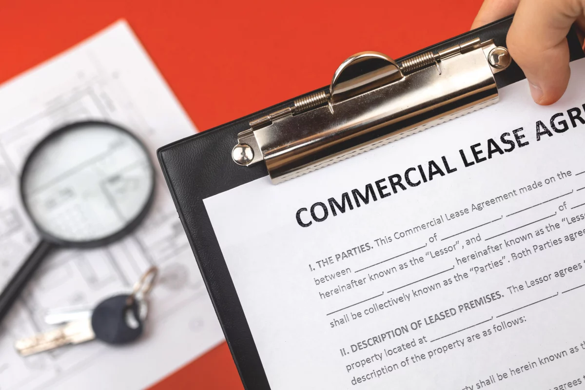 small business owner reviews commercial lease agreement before signing