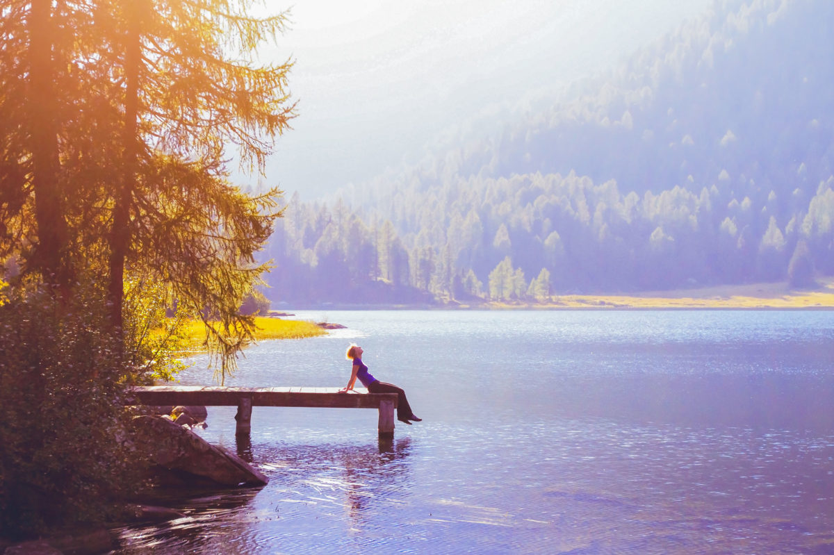 woman enjoying her life at the lakeside