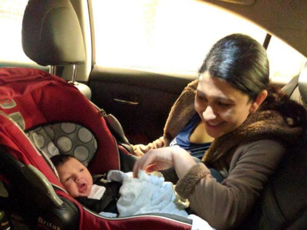 lalit and his wife taking their newborn baby back from the hospital