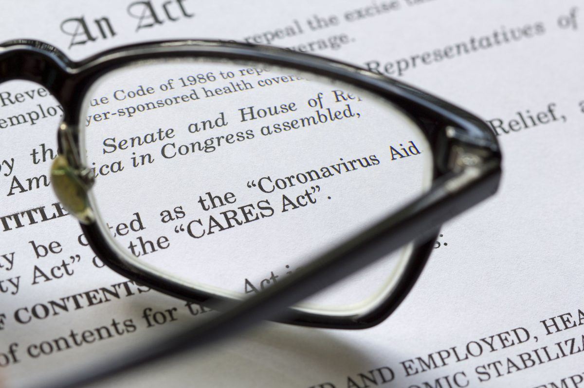 cares act paperwork through prescription glasses lens