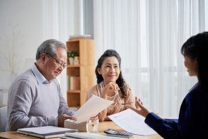 couple choosing estate planning in lawyer office environment